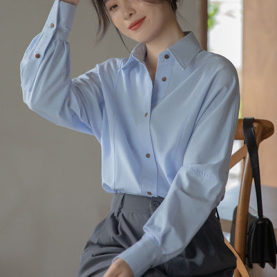 French-style women's shirt, 2026 spring and autumn, white top, new design, layering, niche style, long-sleeved, wrinkle-resistant shirt.